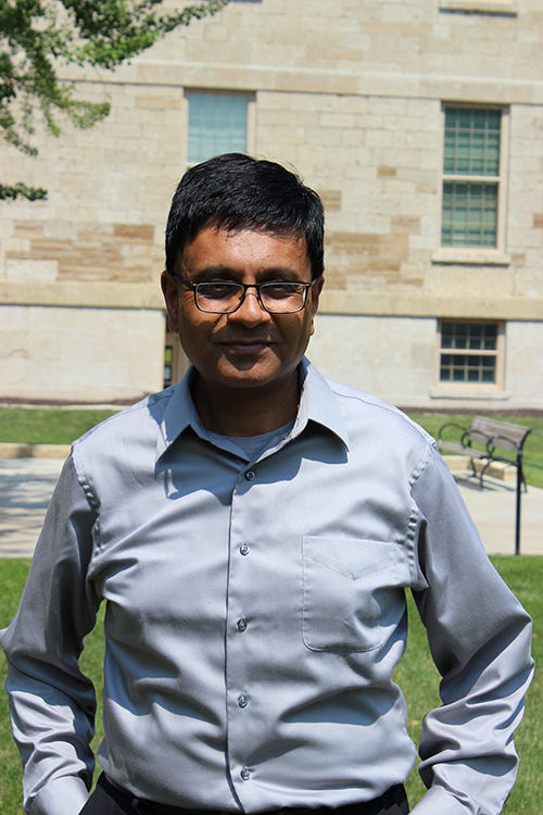 Rahul Singh portrait in front of Old Capitol on UIowa Pentacrest - MB