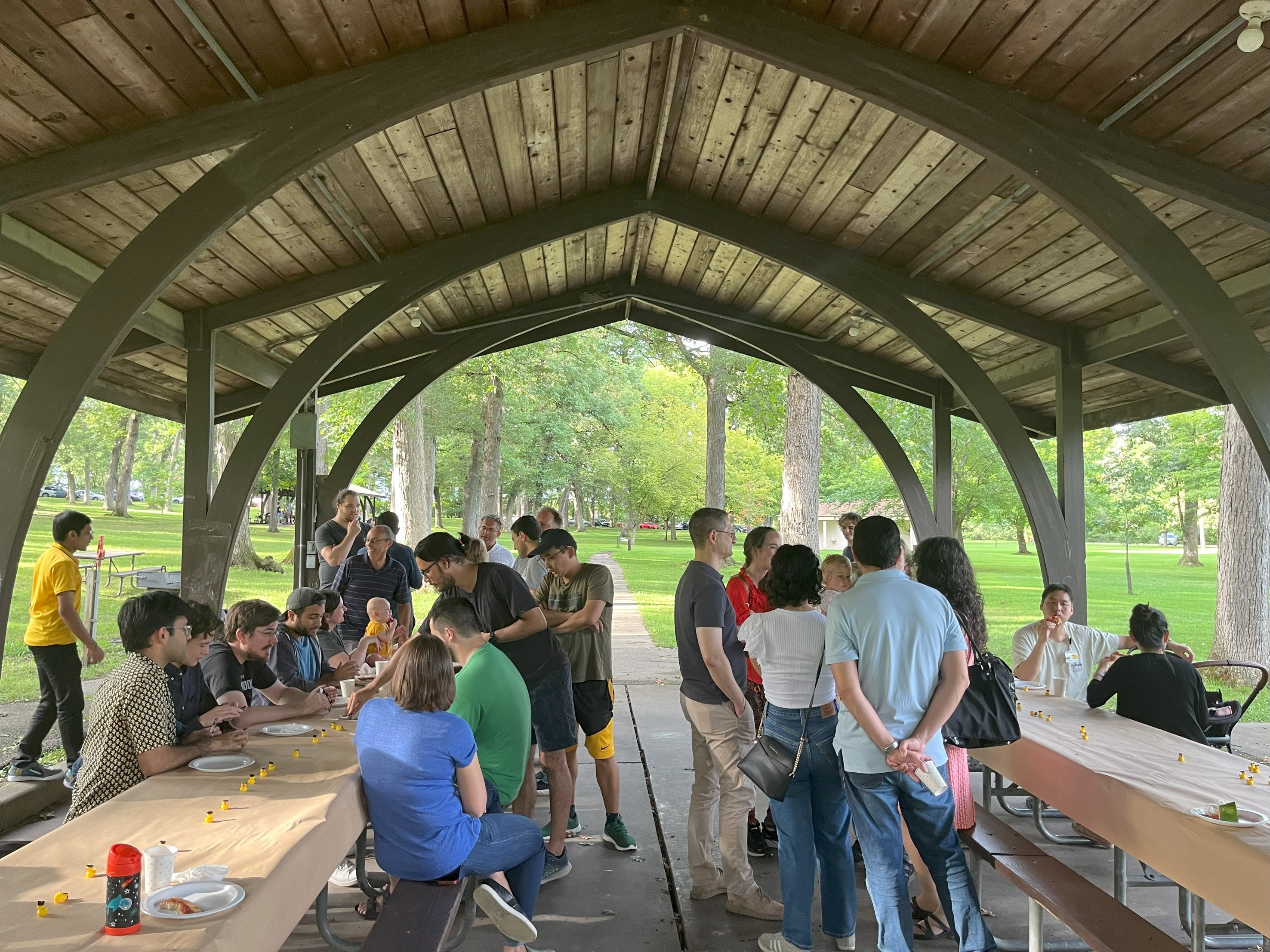 Picture of UIowaCS constituents at Fall 2024 Welcome Picnic, held in Upper City Park shelter in Iowa City on August 30