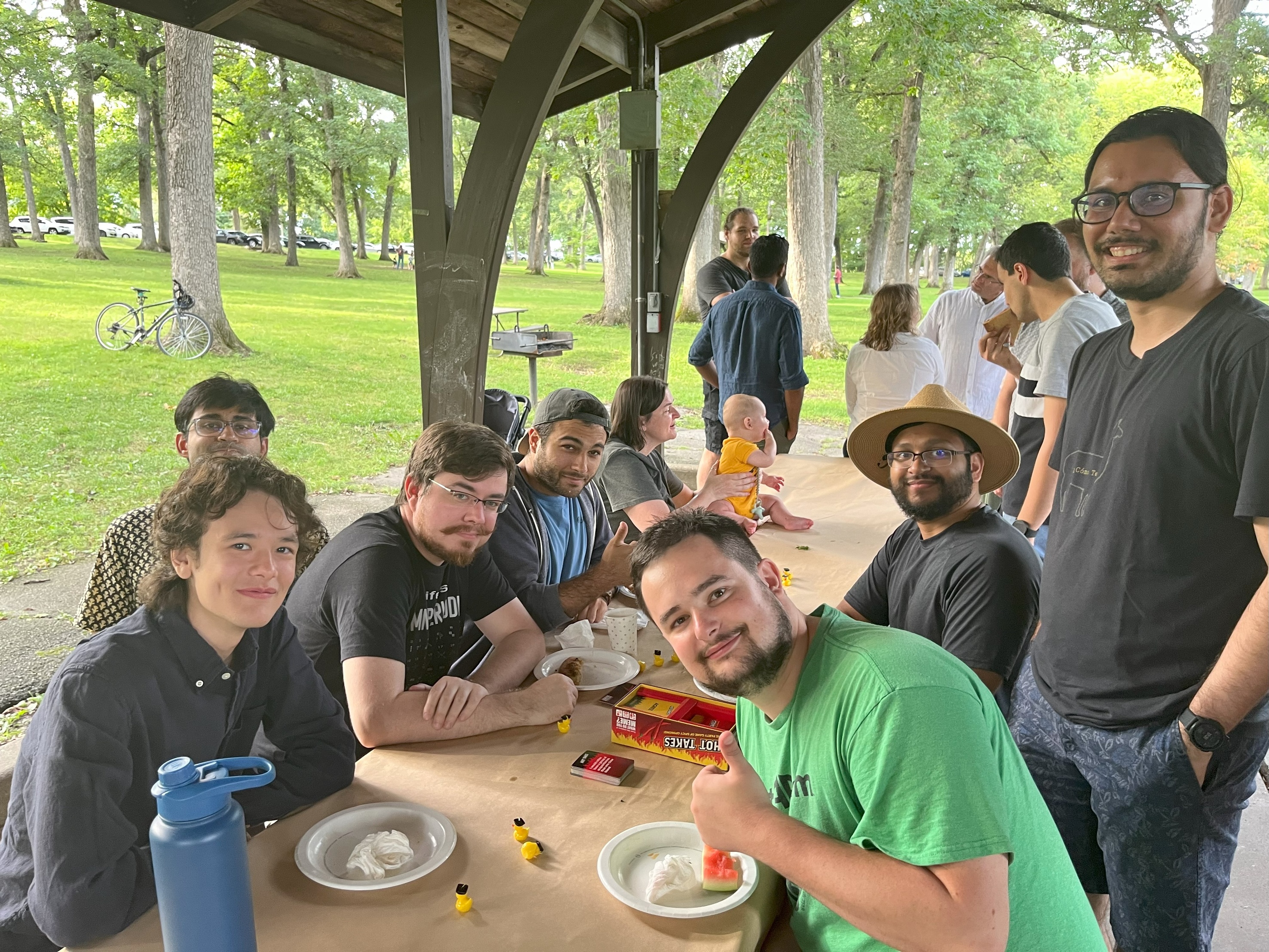 Picture of UIowaCS constituents at Fall 2024 Welcome Picnic, held in Upper City Park shelter in Iowa City on August 30