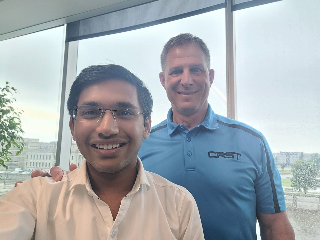 Nahar taking a selfie with the former CEO of CRST, Dave Rusch