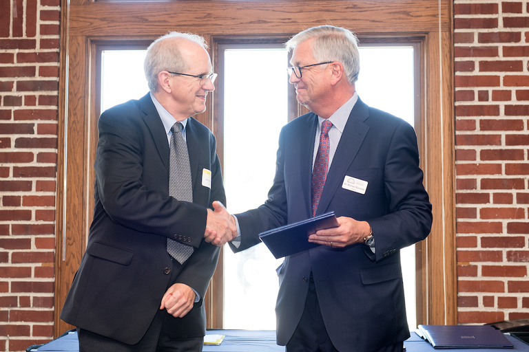 Prof. Kearney receiving award from Board of Regents President Michael Richards