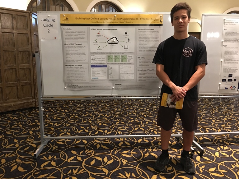Berkun posing in from his 2019 SSTP poster entitled "Enabling User-Defined Security Policies for Programmable IoT Systems"