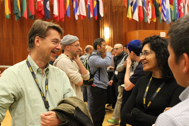 Attendees socializing during a break