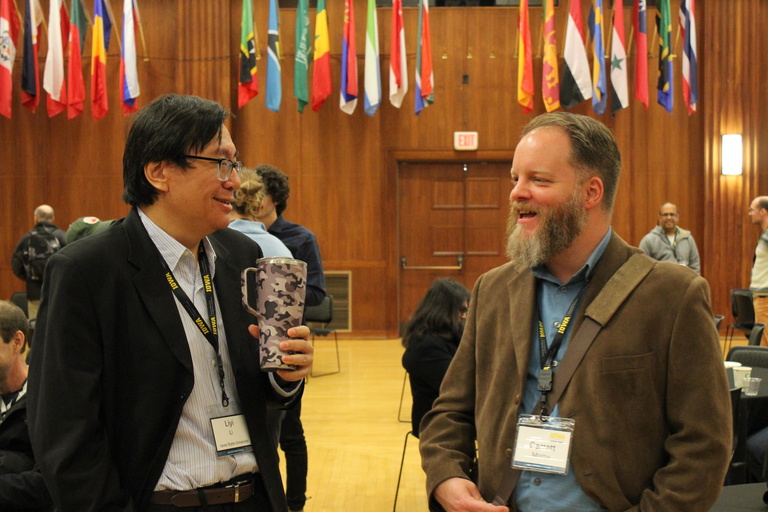 Garrett Morris talks with Liyi Li during a break