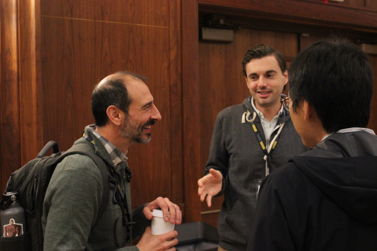 Attendees socializing during a break.