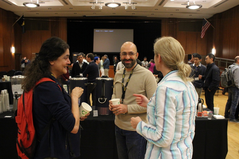 Attendees socializing during a break