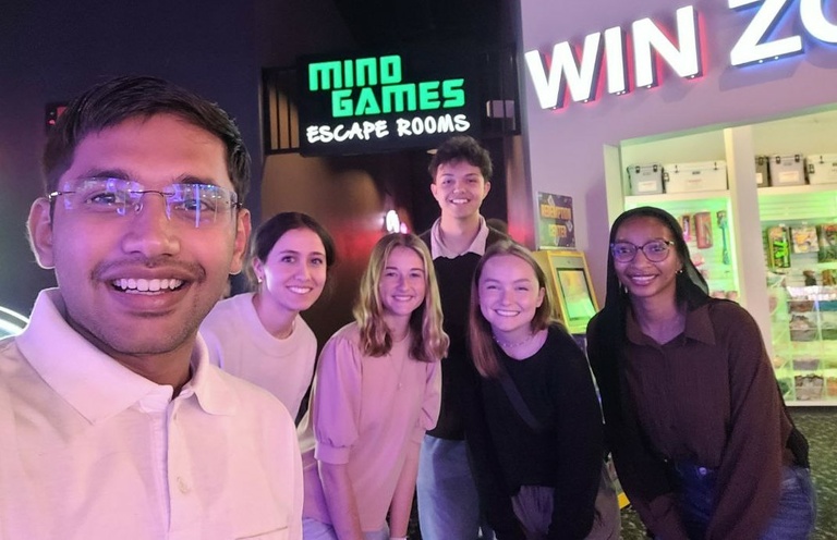 Nahar taking a selfie with the other CRST interns at an escape room