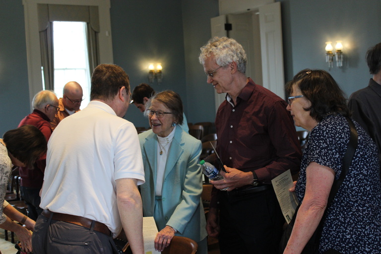 Prof. Segre greeting Mrs. Weeg and fellow guests during Bill Decker Honorary Doctor of Science Reception in May 2024.