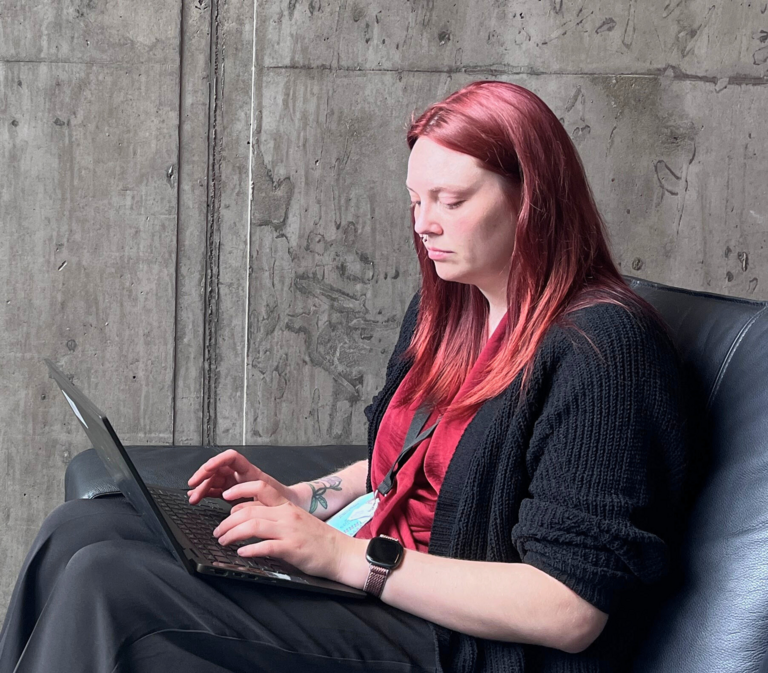 Delaney Norris taking notes at IDC
