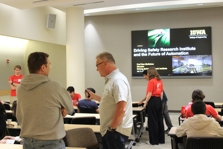 Attendees mingling during the Symposium