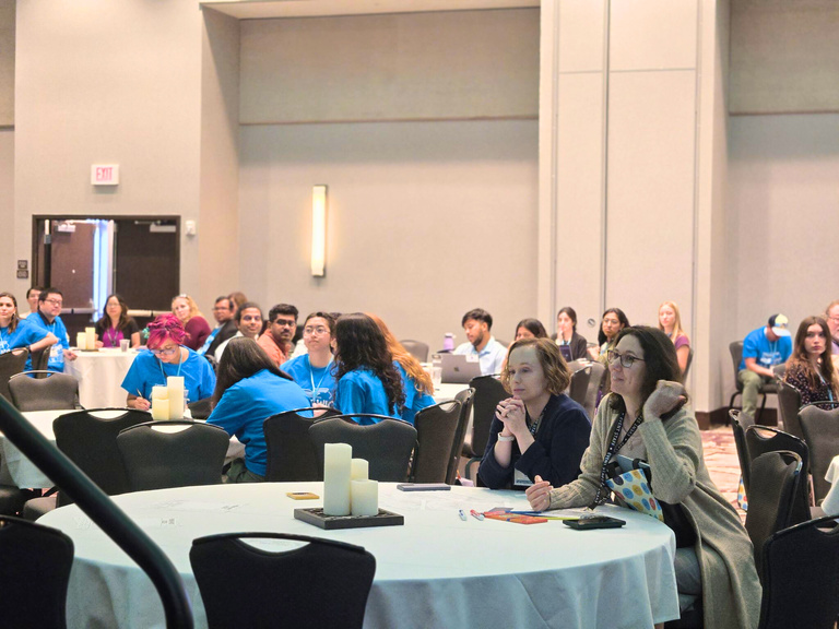 Kleinman listening to presentation at MINK WIC