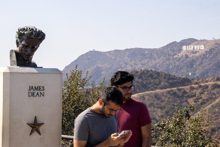 Hussam (PhD CS '25) and Zeeshan Ahmed (MS-CS '21) by James Dean statue