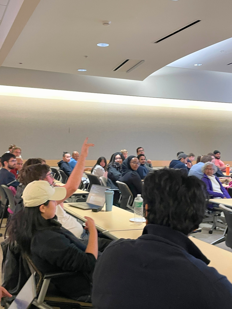 Stuent asking question at grad symposium