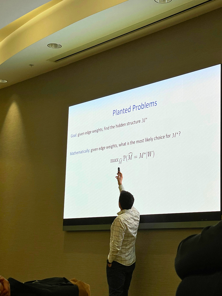 Mehrdad Moharrami presenting charts