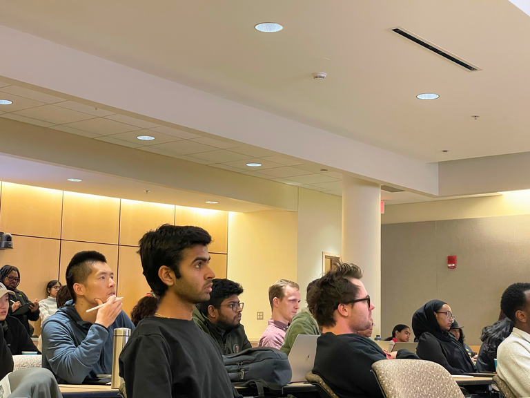 Students listening on grad synposium