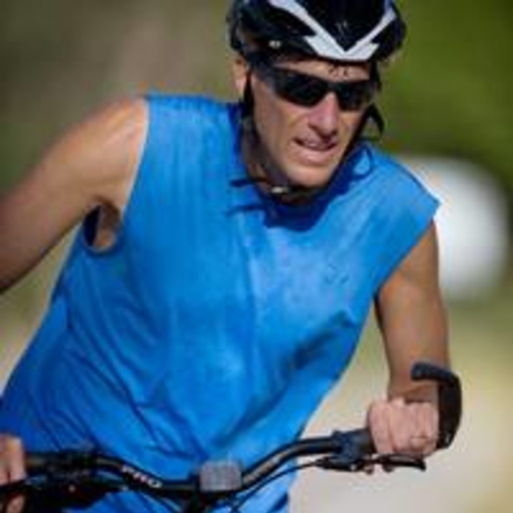 Jim Cremer portrait - on elliptical bike - courtesy of CompEpi website