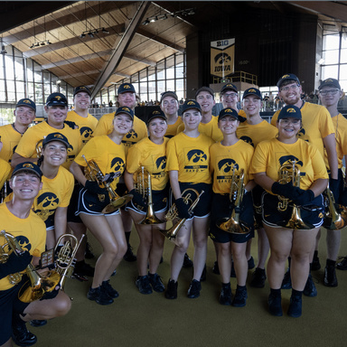 Rece posing with his band section indoors