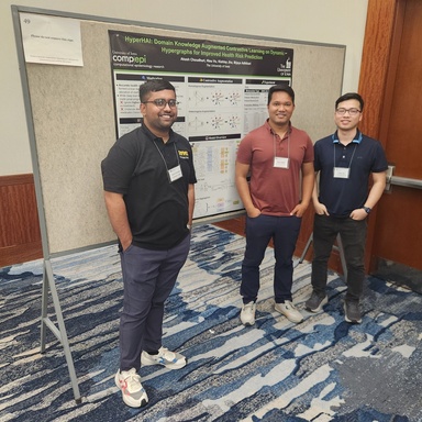 Akash Choudhuri, Bijaya Adhikari, and Hieu Vu in front of their poster "HyperHAI: Domain Knowledge Augmented Contrastive Learning on Dynamic Hypergraphs for Improved Health Risk Prediction".