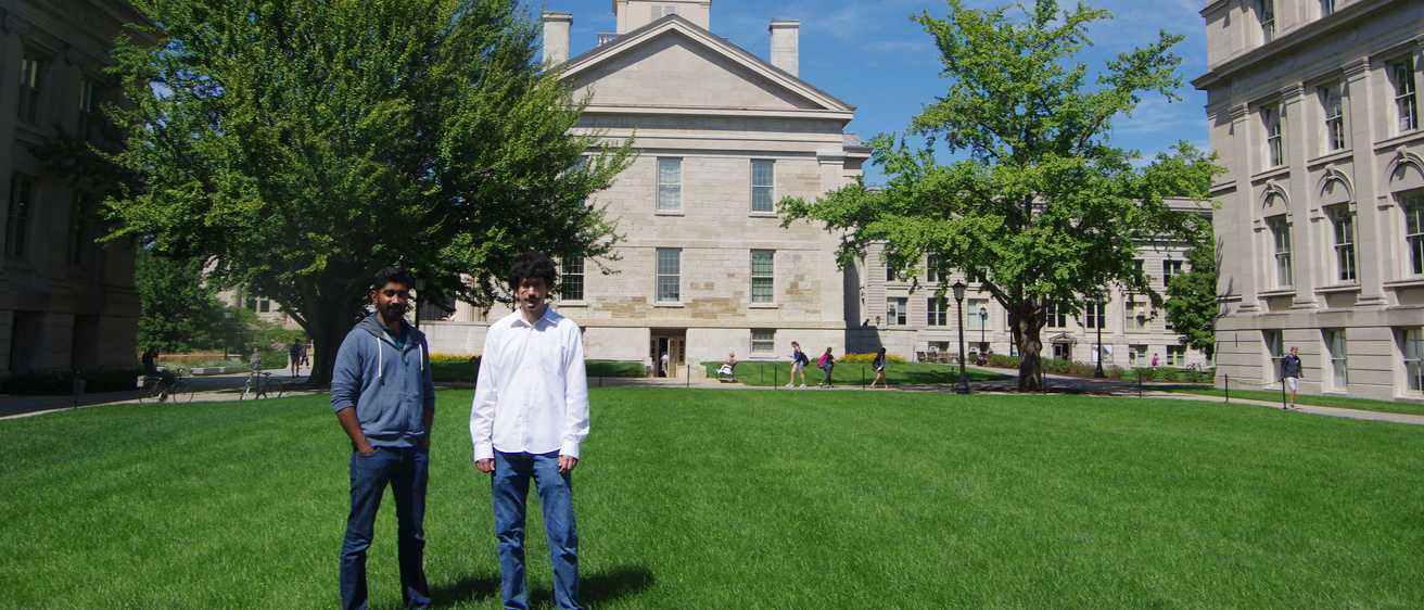 New faculty Bianchi and Nithyanand standing in front of Old Capitol