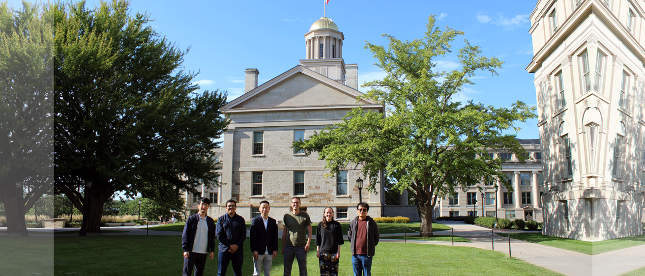 Group picture of incoming UIowaCS faculty, with Old Capitol building in the background