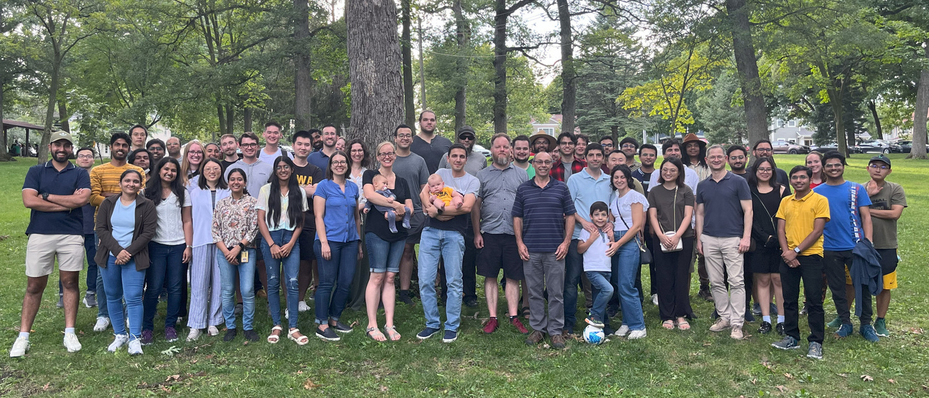 Group picture of UIowaCS grad students, faculty, and staff attending Fall 2024 Welcome Picnic at Upper City Park, Iowa City, IA