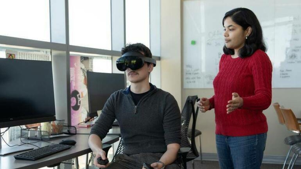 Kean University Assistant Professor Lakshmi Subramanian, Ph.D., and student researcher Brandon Mirabal use VR technology to research how autonomous vehicles impact pedestrian safety. [Photo Credit: Kean University]